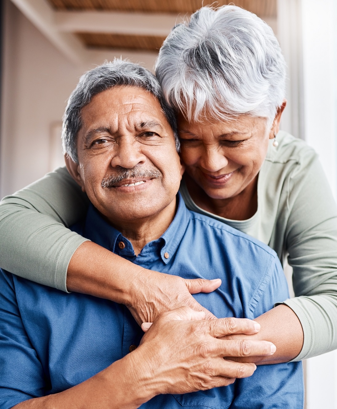 clinical trial participant getting a hug from his wife
